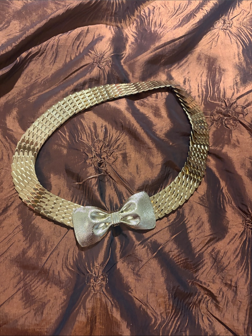 Vintage gold tone stretch belt with bow tie clasp